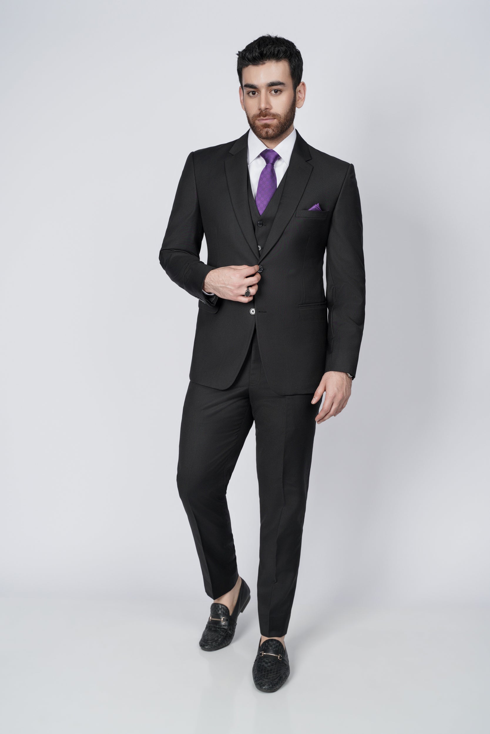 Solid black three piece suit