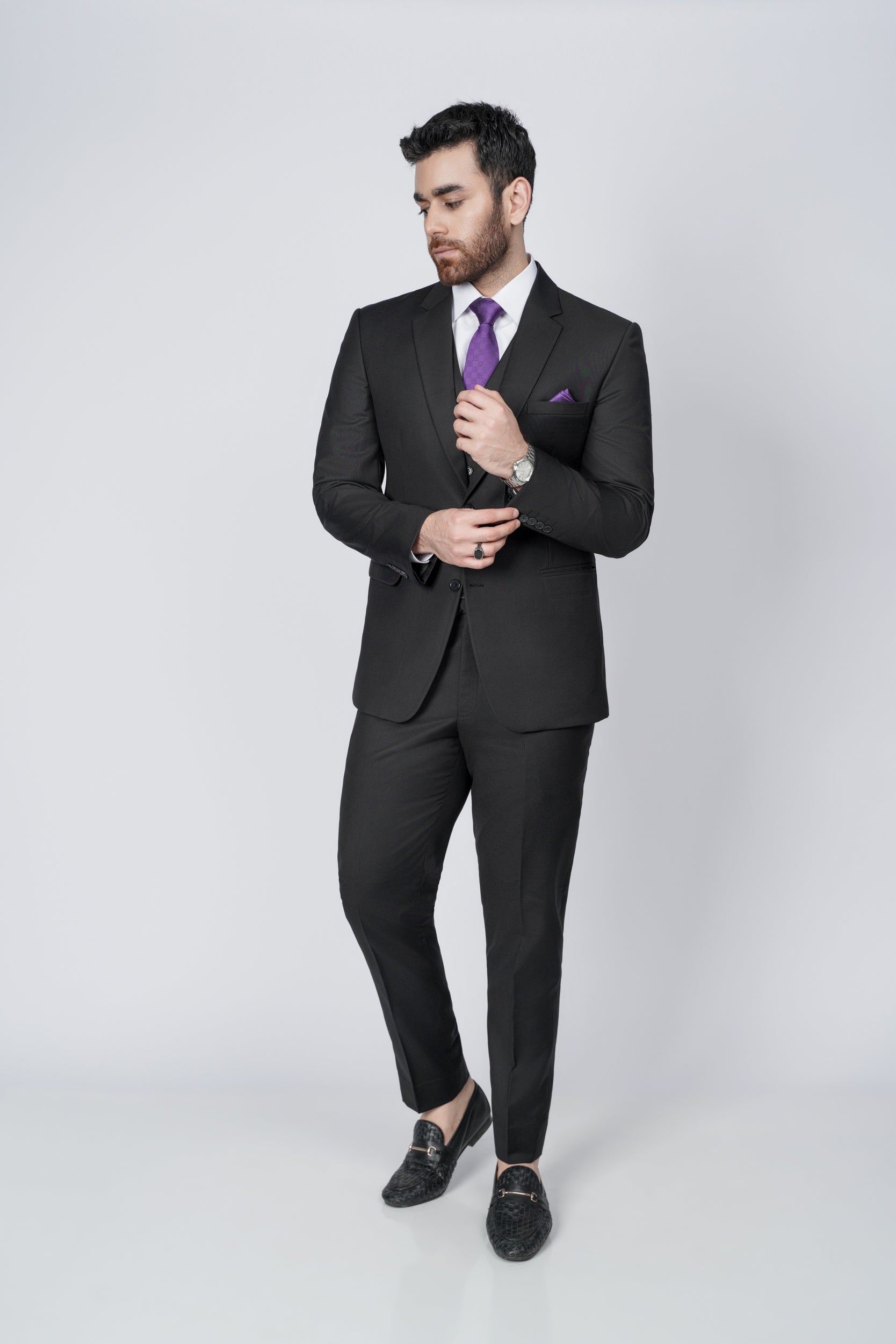 Solid black three piece suit