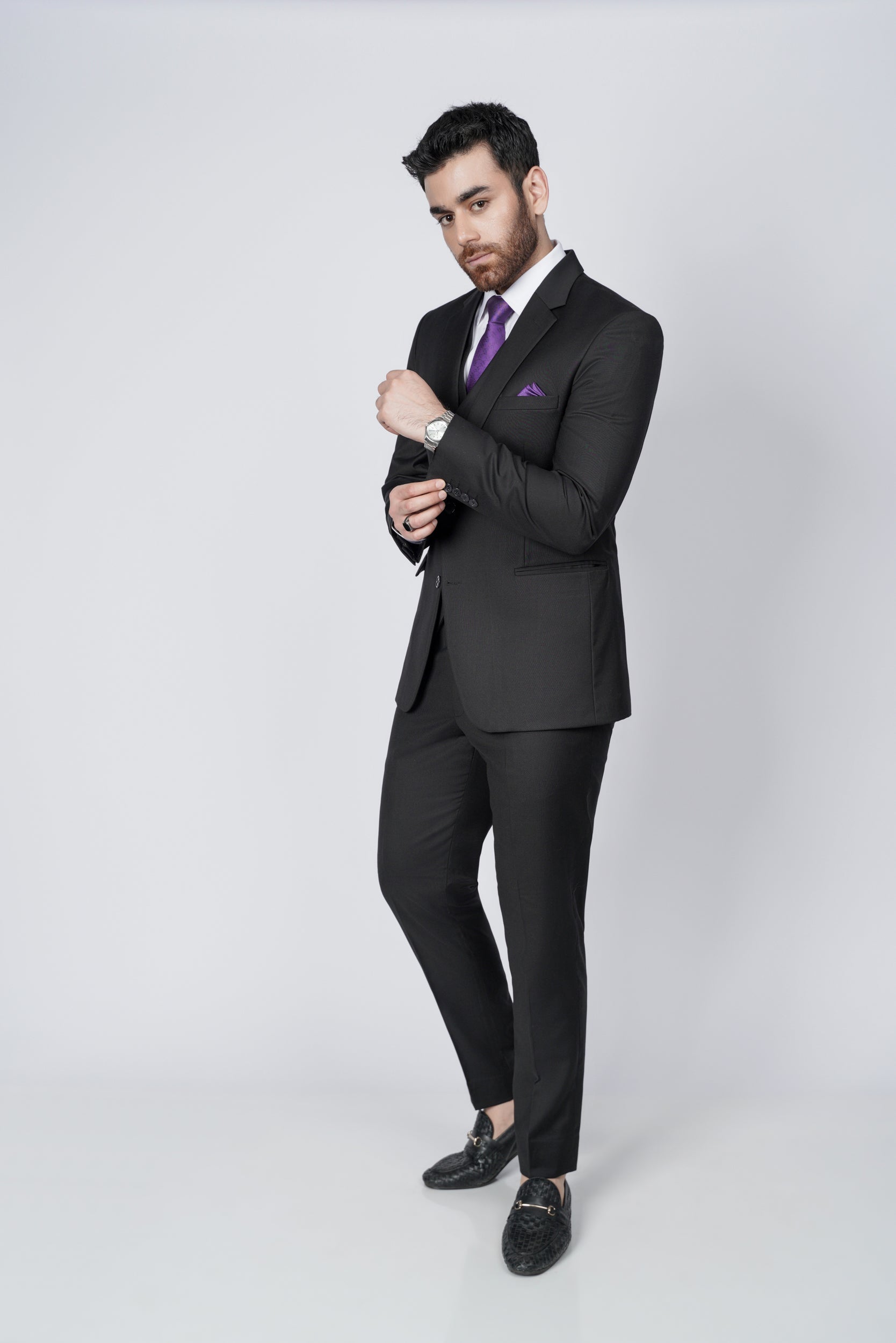 Solid black three piece suit