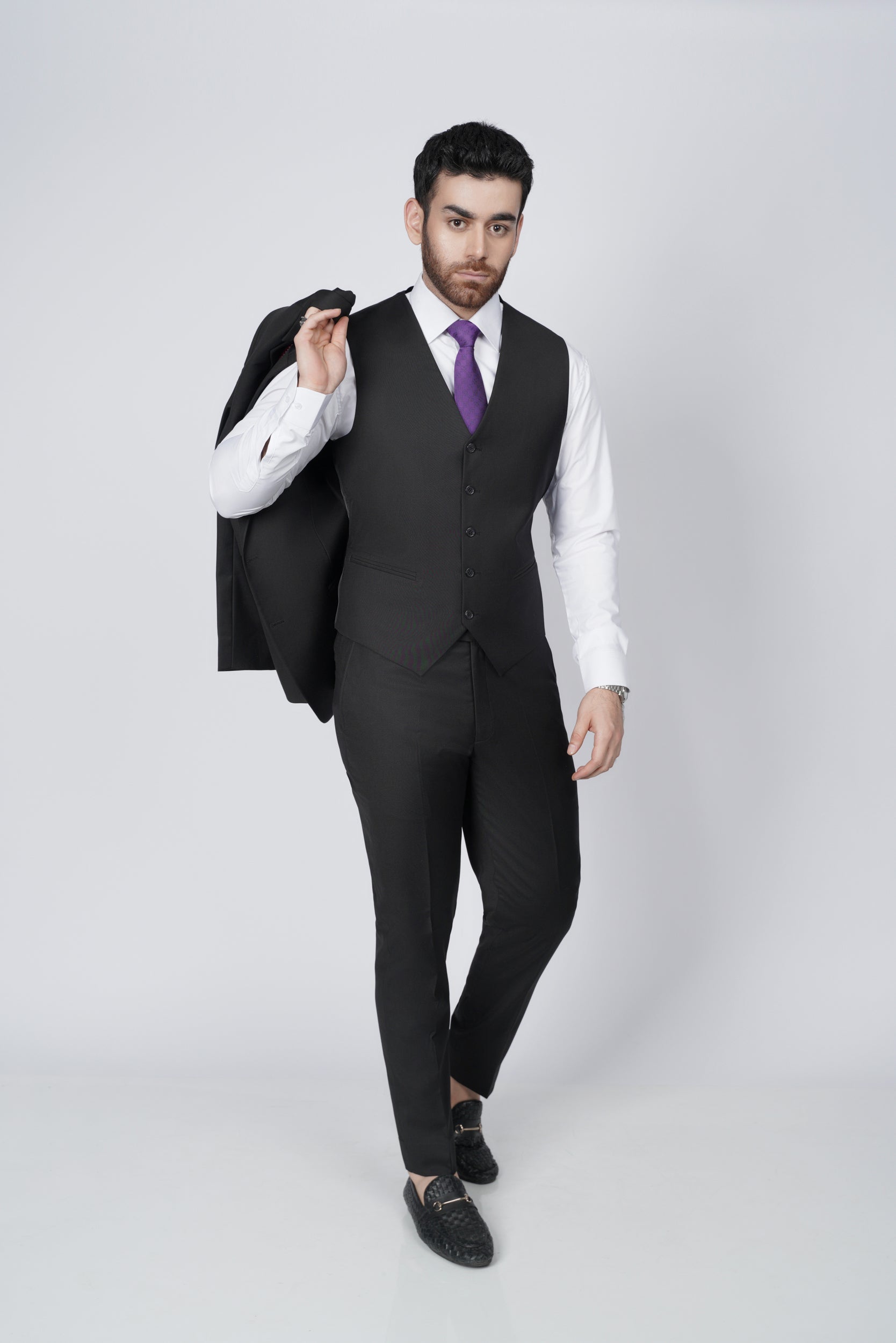 Solid black three piece suit