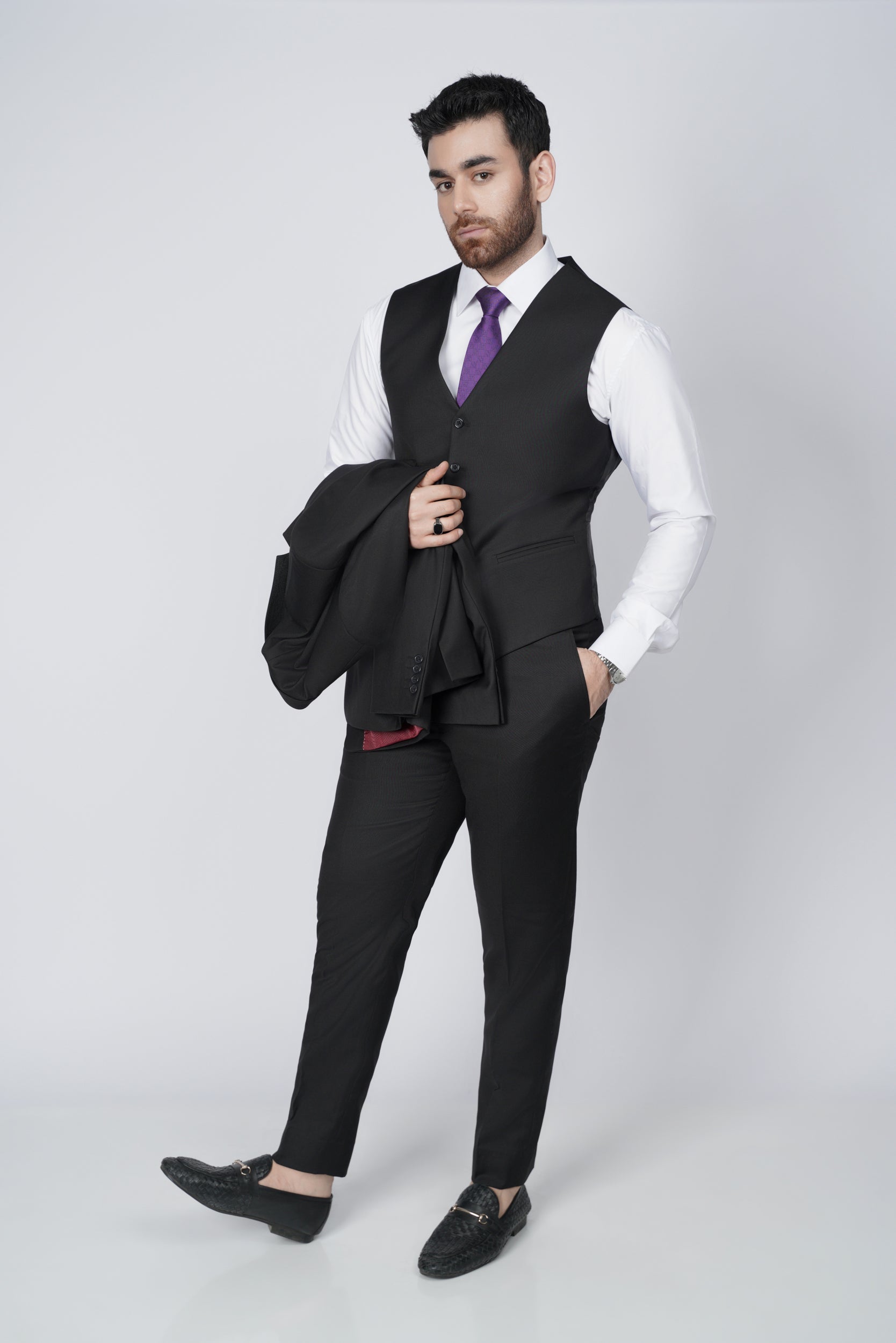 Solid black three piece suit